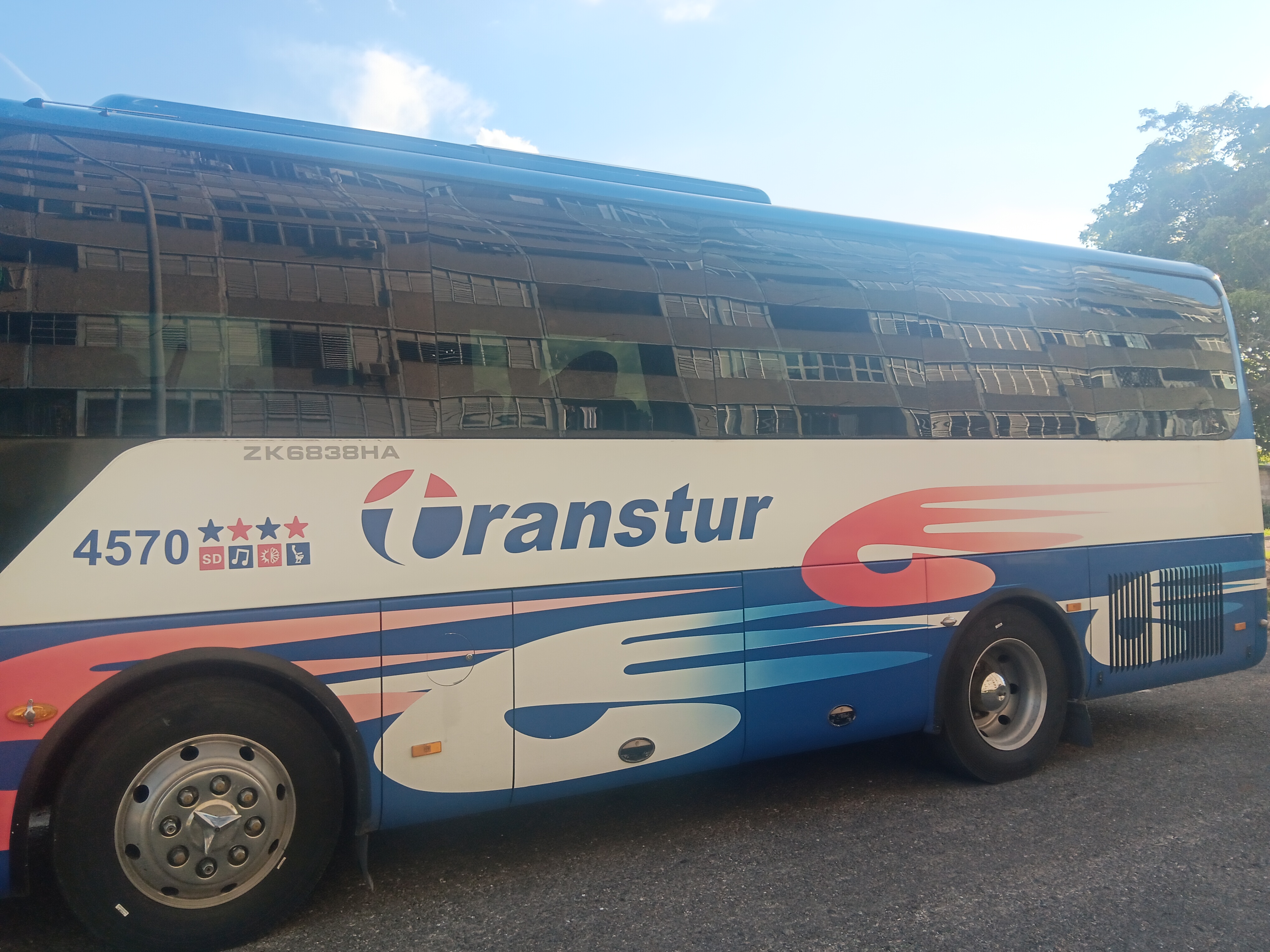 My entry for the Reflection Hunters Contest Round 247: My building on the window of a bus