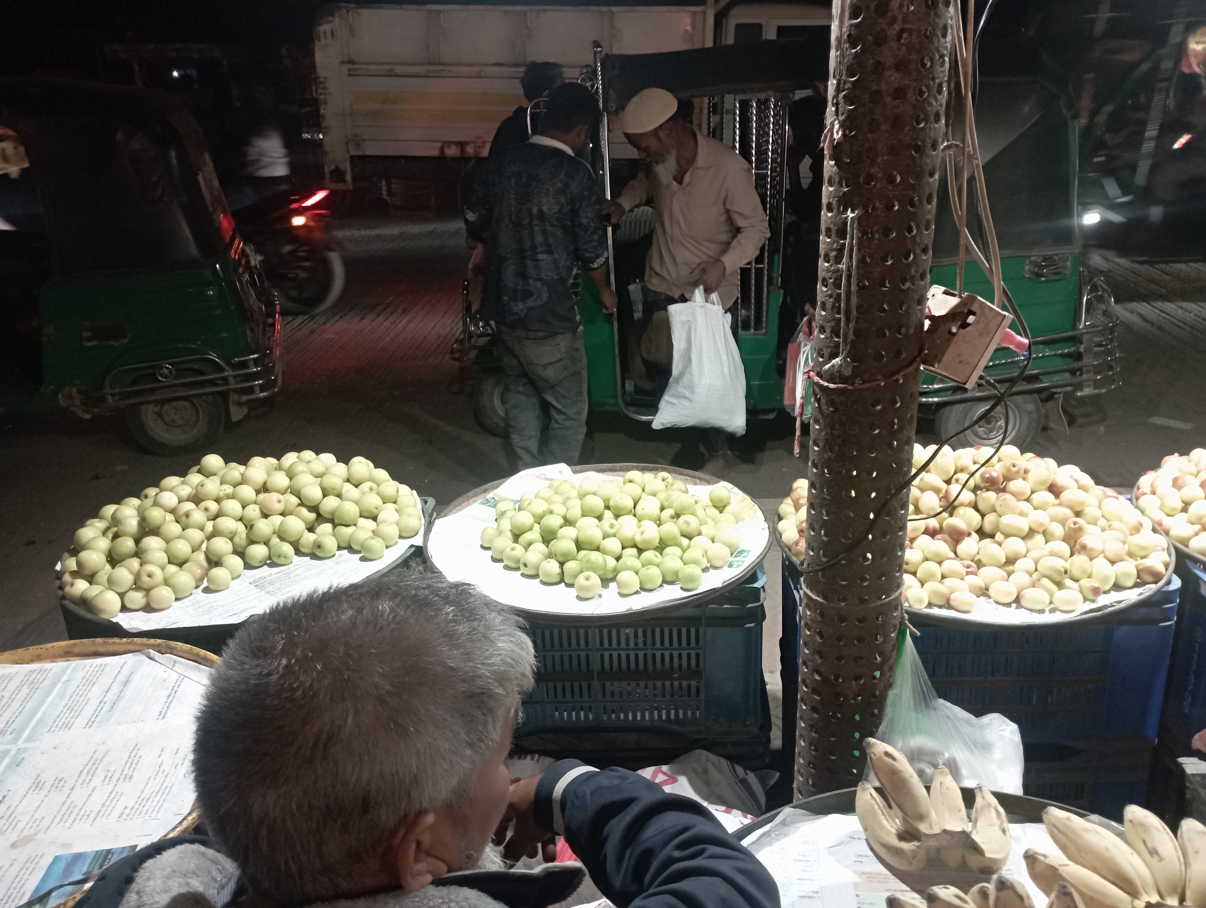 A wonderful view of the shops selling various products at the CNG station at night