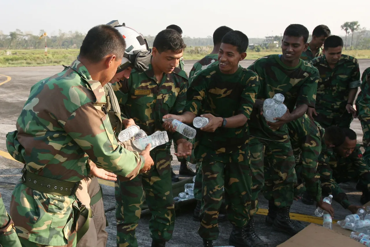 US_Navy_071123-M-7696M-062_Bangladeshi_soldiers_unload_a_shipment_of_bottled_water_delivered_by_Marines_of_Marine_Medium_Helicopter_Squadron_(HMM)_261,_the_aviation_element_of_the_22nd_Marine_Expeditionary_Unit_(MEU).jpg