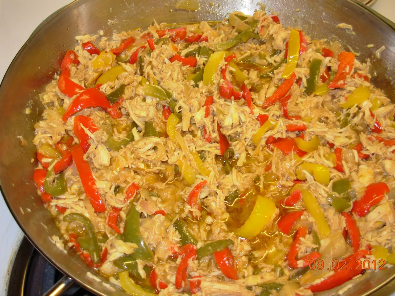 Chicken, Peppers and Onions cooking together with some soy sauce.jpg