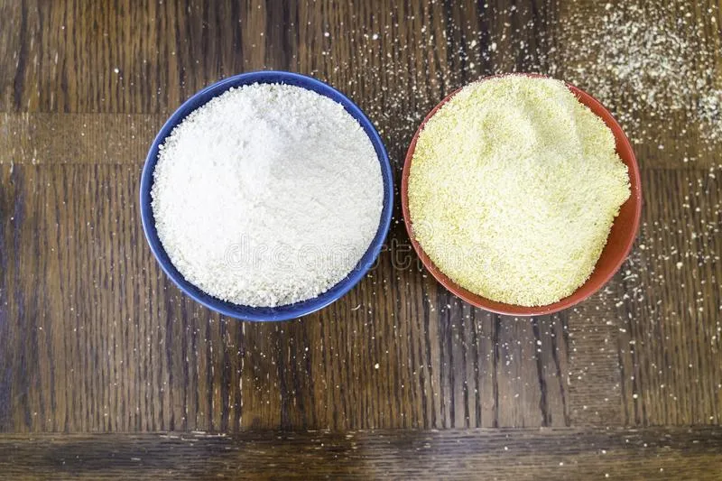 two-bowls-yellow-white-garri-table-nigerian-staple-two-bowls-yellow-white-nigerian-garri-table-147257958.jpg