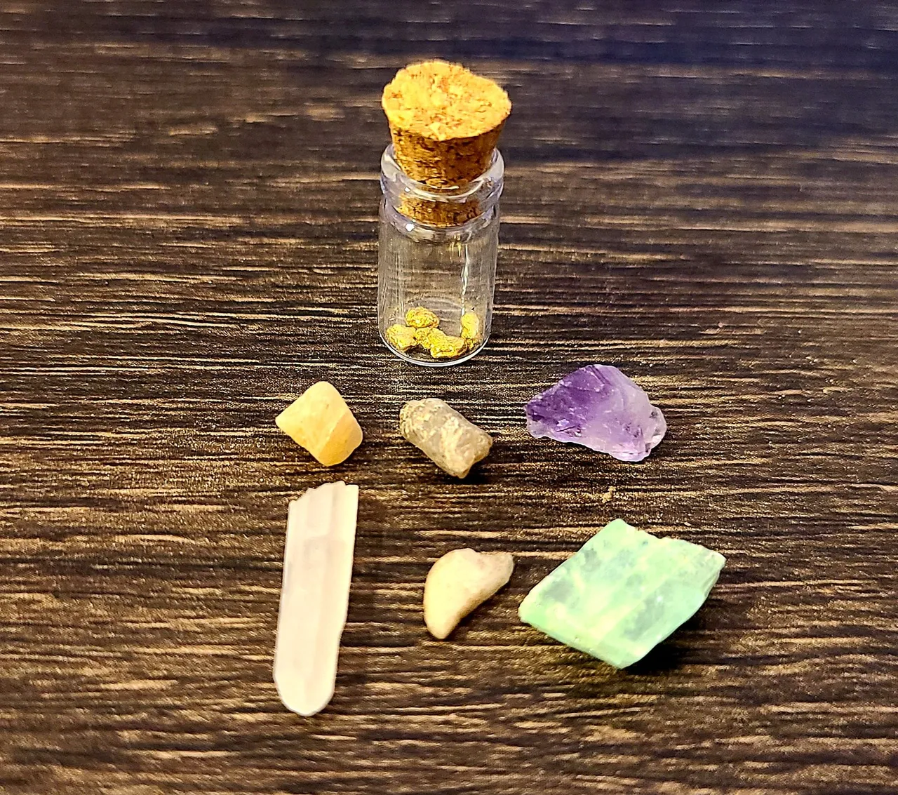 All of our finds from this one bag, including some raw emerald! (the over-exposed stone, bottom right)