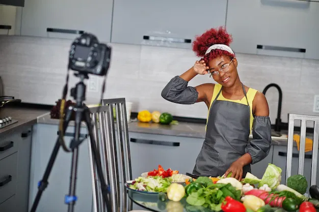 african-american-woman-filming-her-blog-broadcast-about-healthy-food-home-kitchen_627829-4915.webp