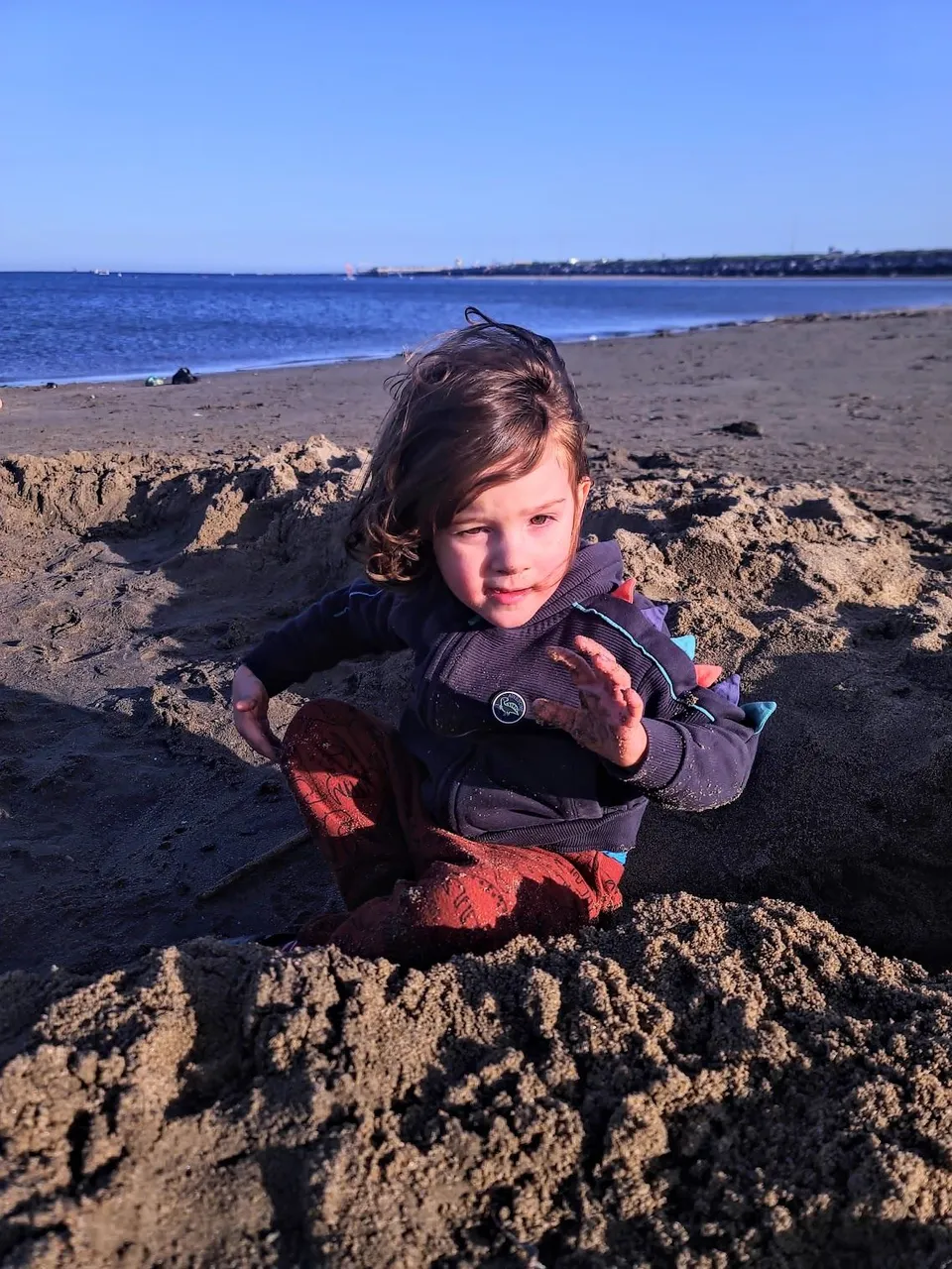 Getting tired of the sand at this point. He got some in his eyes and was not happy!
