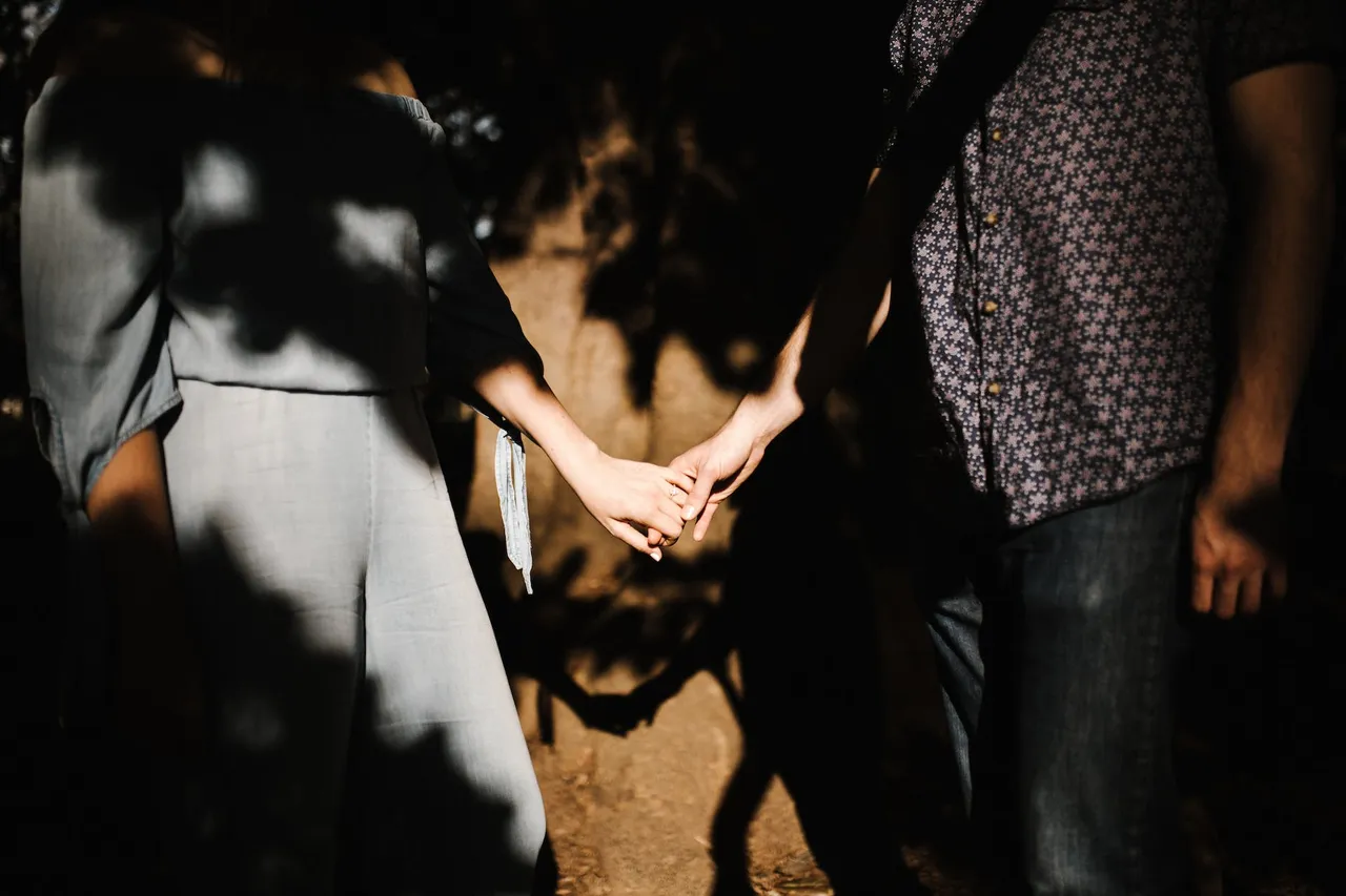two people holding hands in marriage