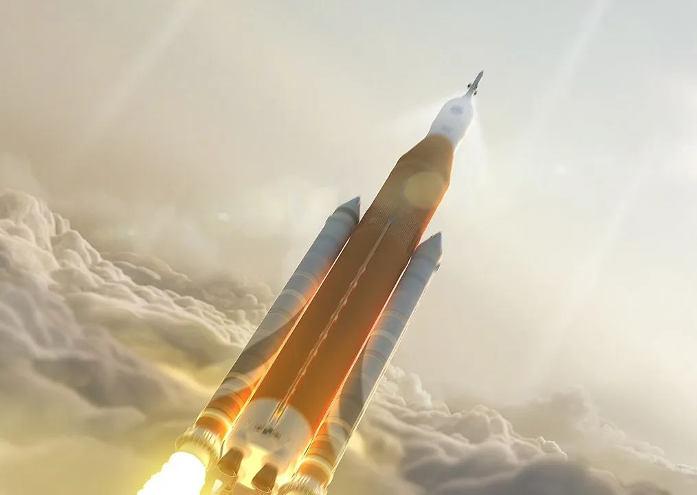1014px-Orange_tank_SLS_launch_through_clouds_-_Post_CDR.jpg