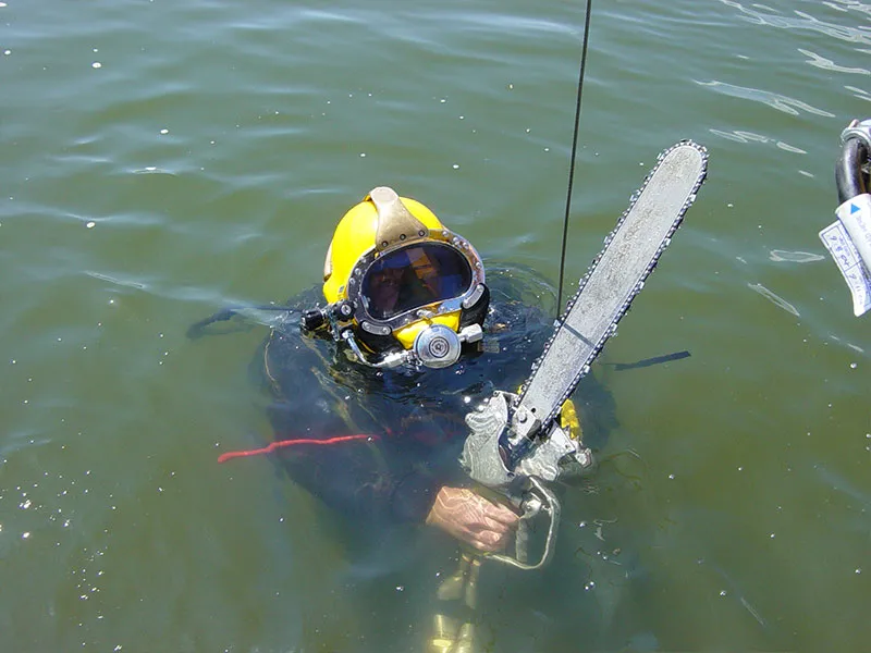 Commercial Diver with Submersible Chainsaw
