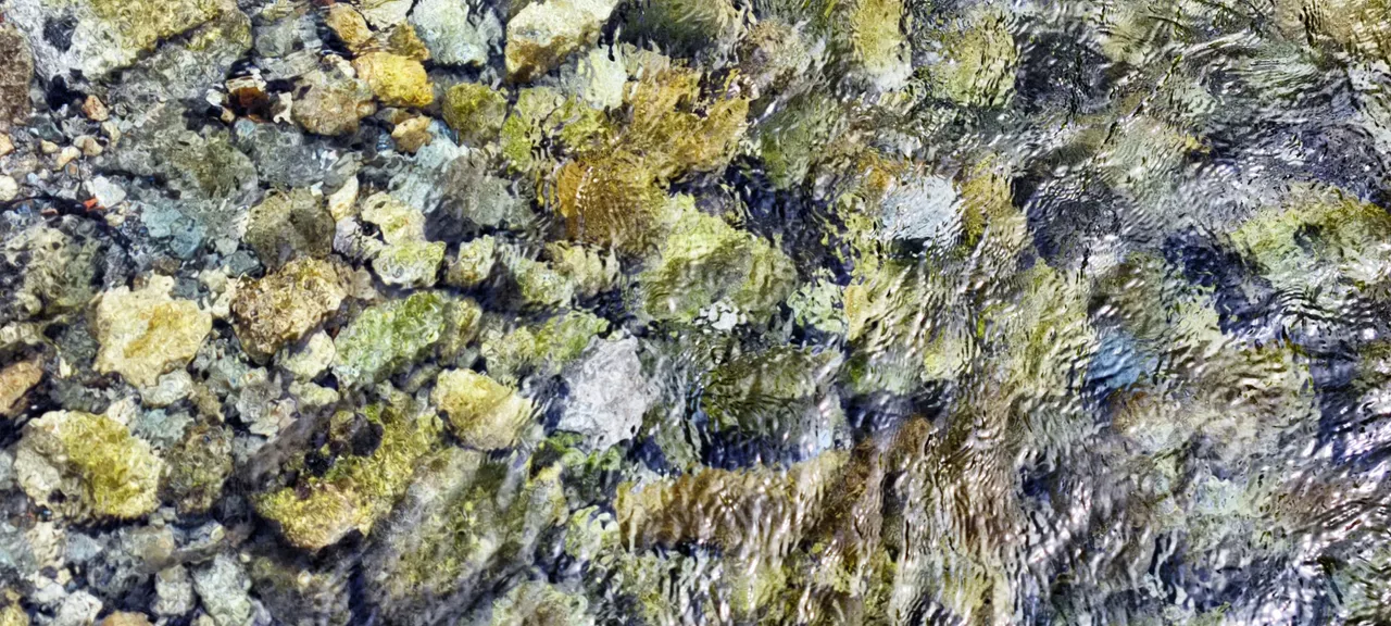 Clear water over stones