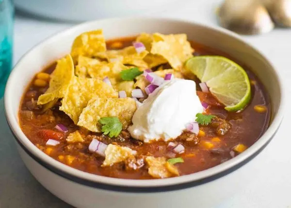 Slow Cooker Taco Soup with sour cream and chips