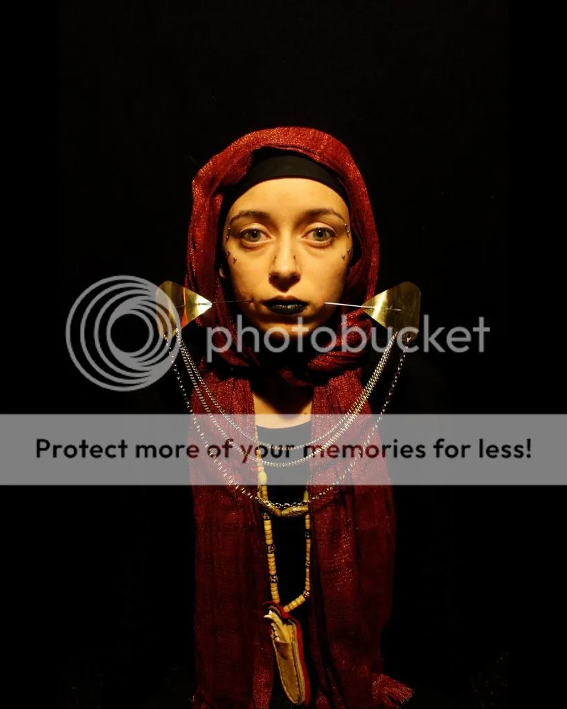 photo Naomi-Clayton-vow-of-silence-cheek-spear.jpg