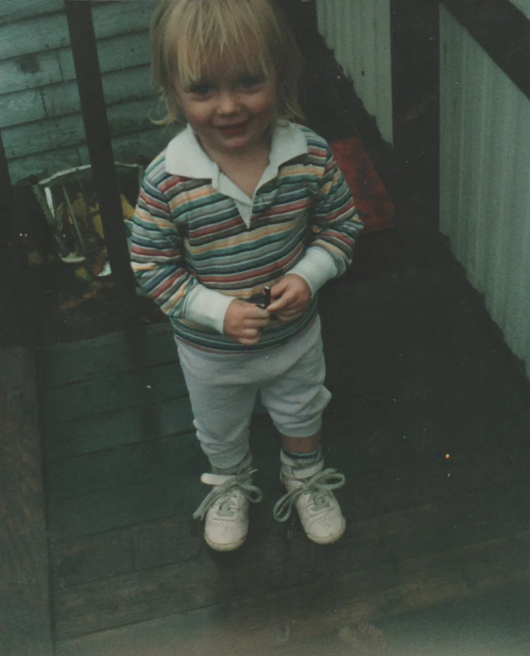 1991-10 - Crystal on the 163 front porch in stripes shirt.png