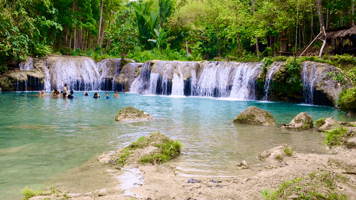 The third tier of Cambugahay Falls. The pool is at waist's height for most of the people in the pool