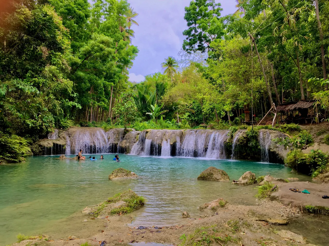 A landscape view of the stunning Cambugahay Falls
