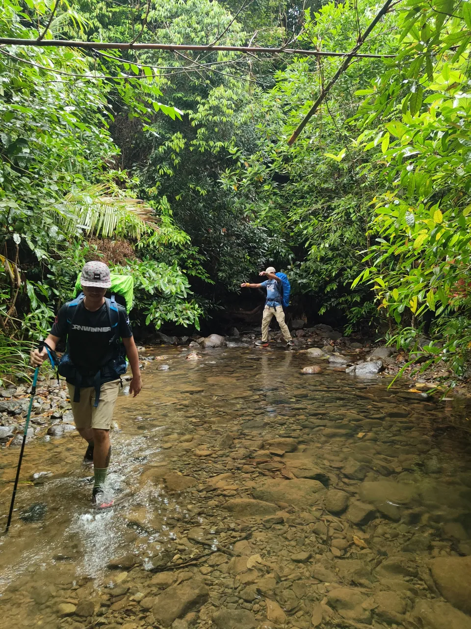 Exhibit A: Johnrel unbothered getting wet | Exhibit B: Doc Abel trying to balance on top of the stones