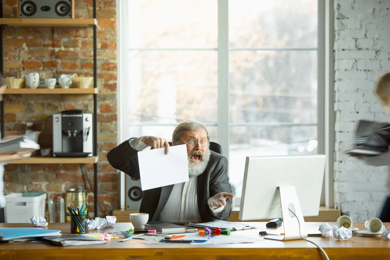 nervous-tired-boss-his-workplace-busy-while-people-moving-near-blurred-office-worker-manager-working-has-problems-deadline-his-colleagues-distracting-business-work-workload-concept.jpg