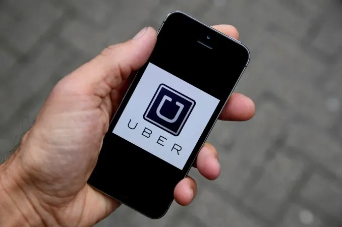 1489753904_uber-app-logo-seen-mobile-telephone.jpg