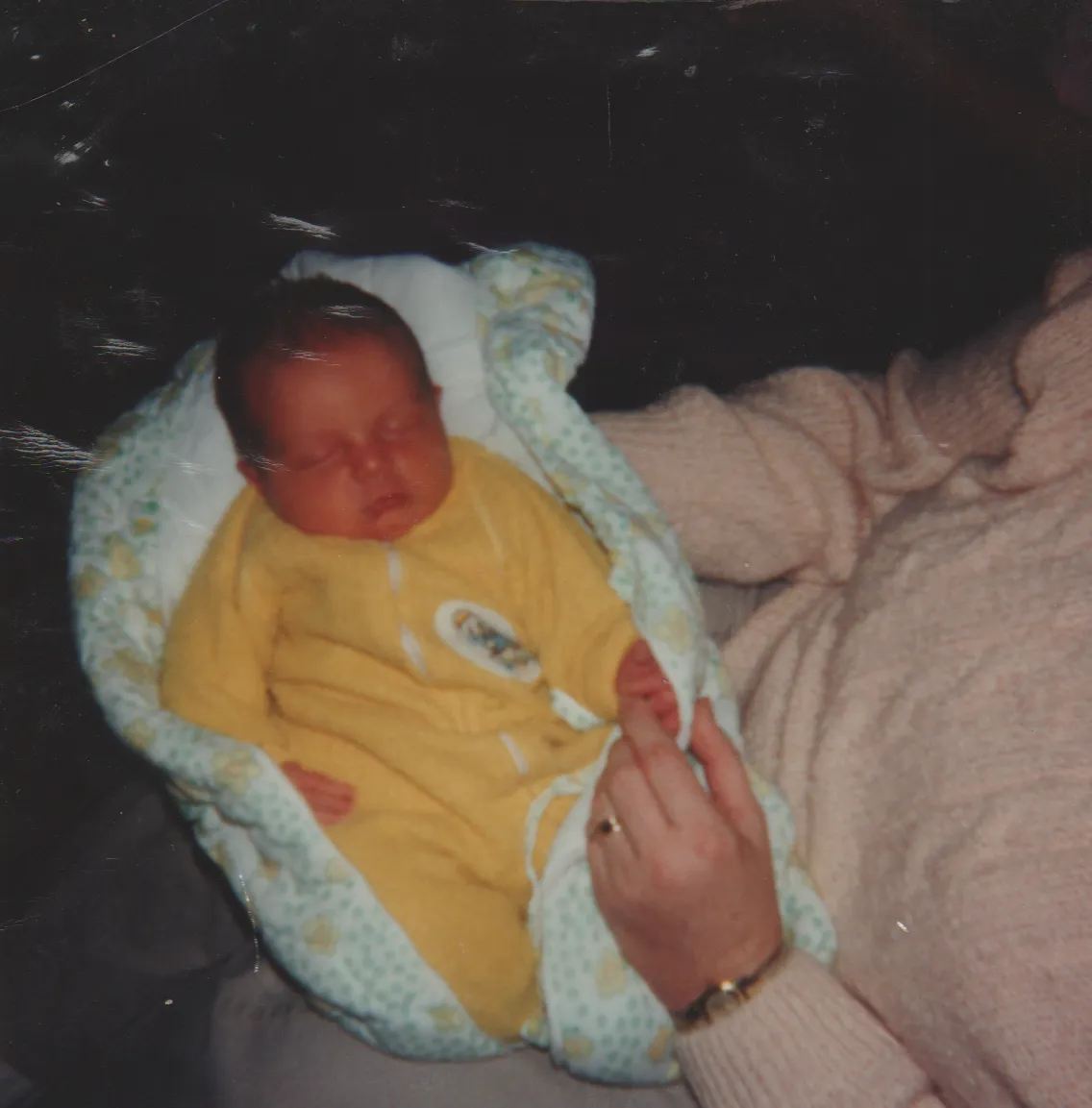 1990-03-08 - Thursday - Crystal Ann Arnold as a baby in yellow, March of 1990, 4 and a half days old.png