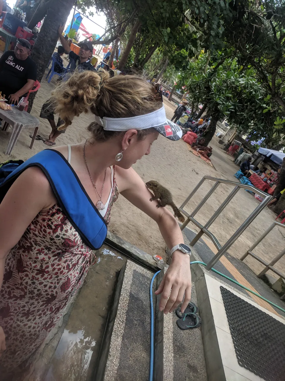 As we walked through the beach markets at Kuta on our last day, Caroline spotted a man whose job was to care for the public amenities. He had a squirrel as a pet and he insisted it was quite friendly and was happy to let it jump onto her arm for her to get closer to it. It made her day.