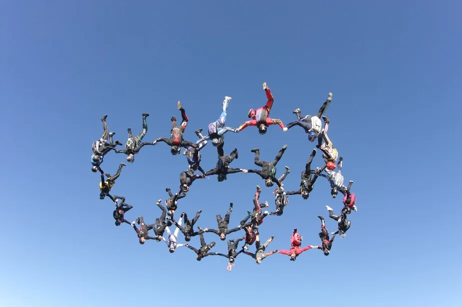 Image of skydivers building a formation