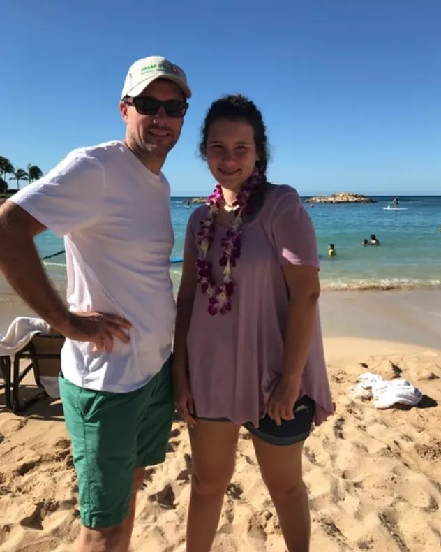 dad and adelynn on beach