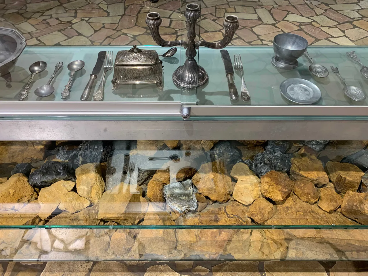 crude ore with silver and silverware