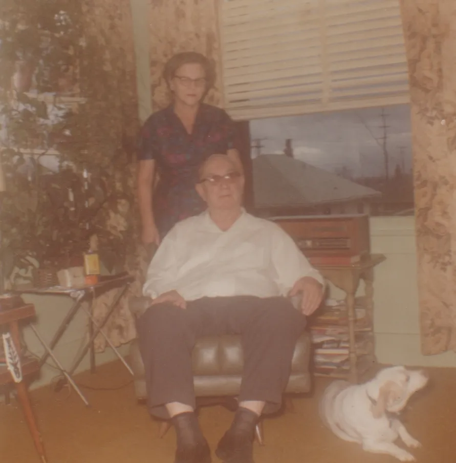 1971-12 - Ann, Charles Dwight Pickett, Tiffany dog who was supposed to sit between grandpa's feet but didn't at Charles & Ann's house in Seattle.jpg