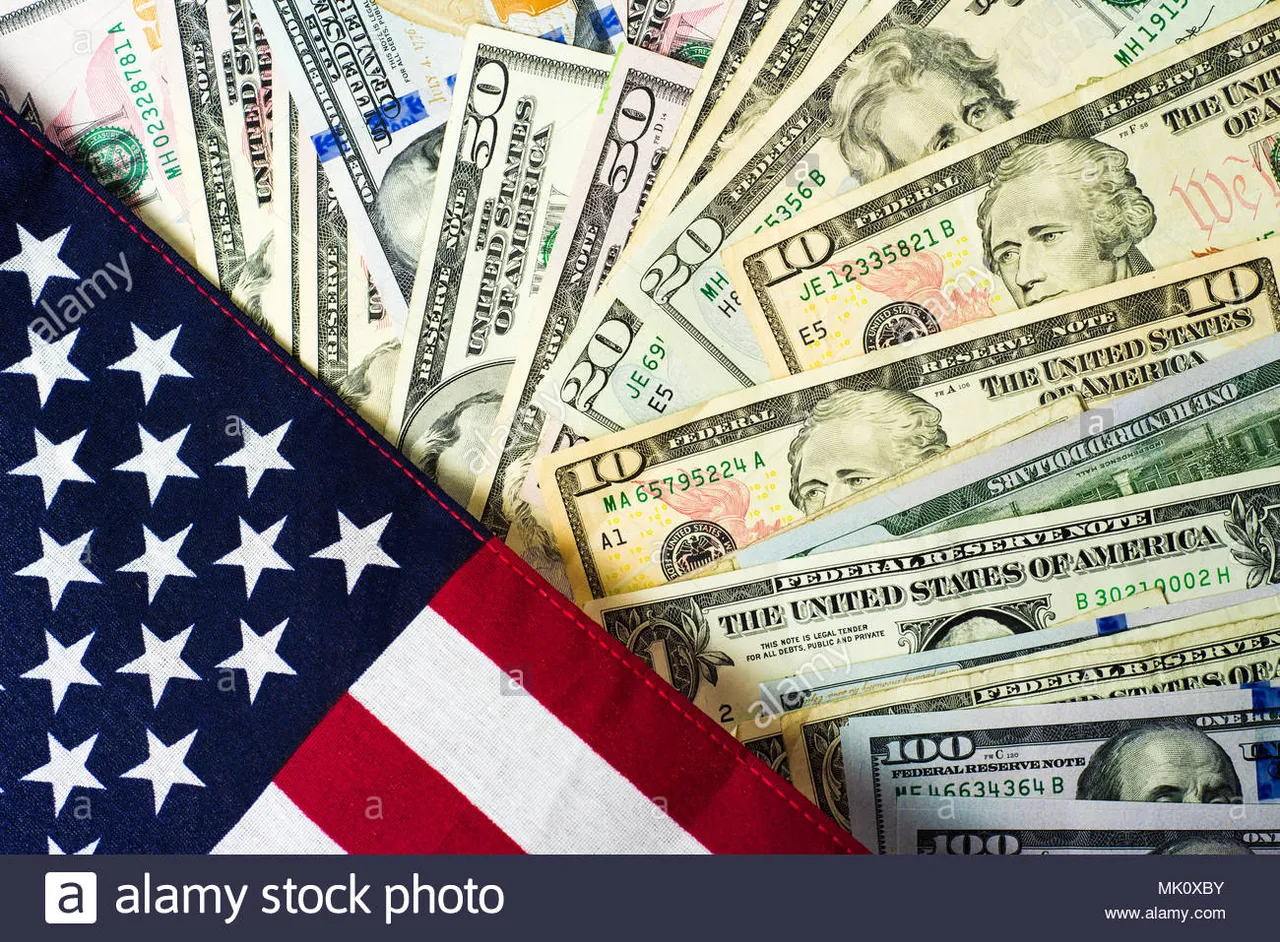 american-flag-and-banknotes-usd-currency-money-MK0XBY.jpg