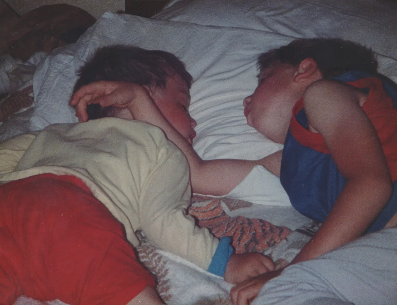 1988 - Ricky & Joey fell asleep on a bed.png