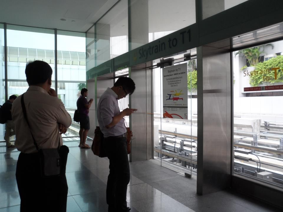 My dad (left) waiting for the train to arrive