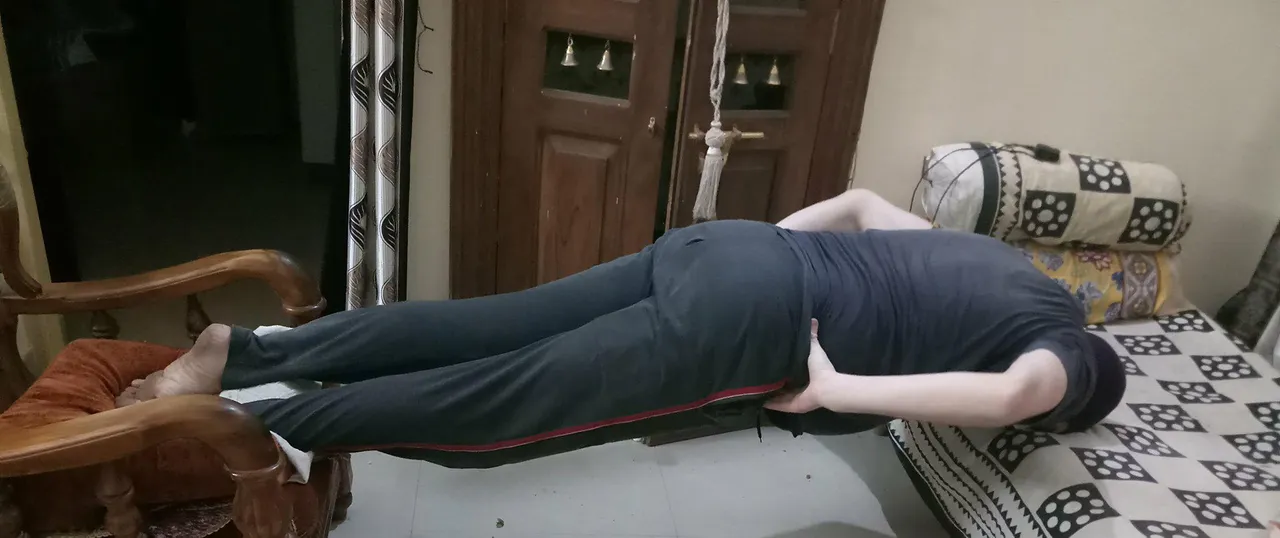 Anterior neck plank with feet and head on even height objects with gap in between.jpg
