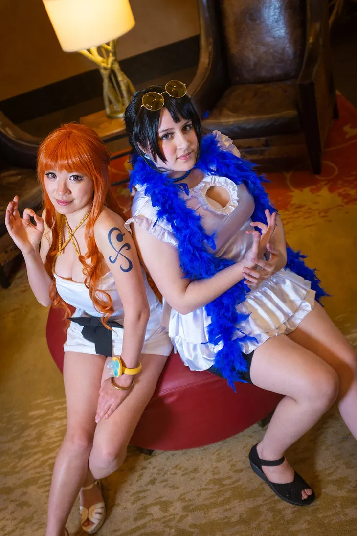 nami_nico_robin_film_gold_one_piece_cosplay_by_firecloak-dcmhi9x.jpg