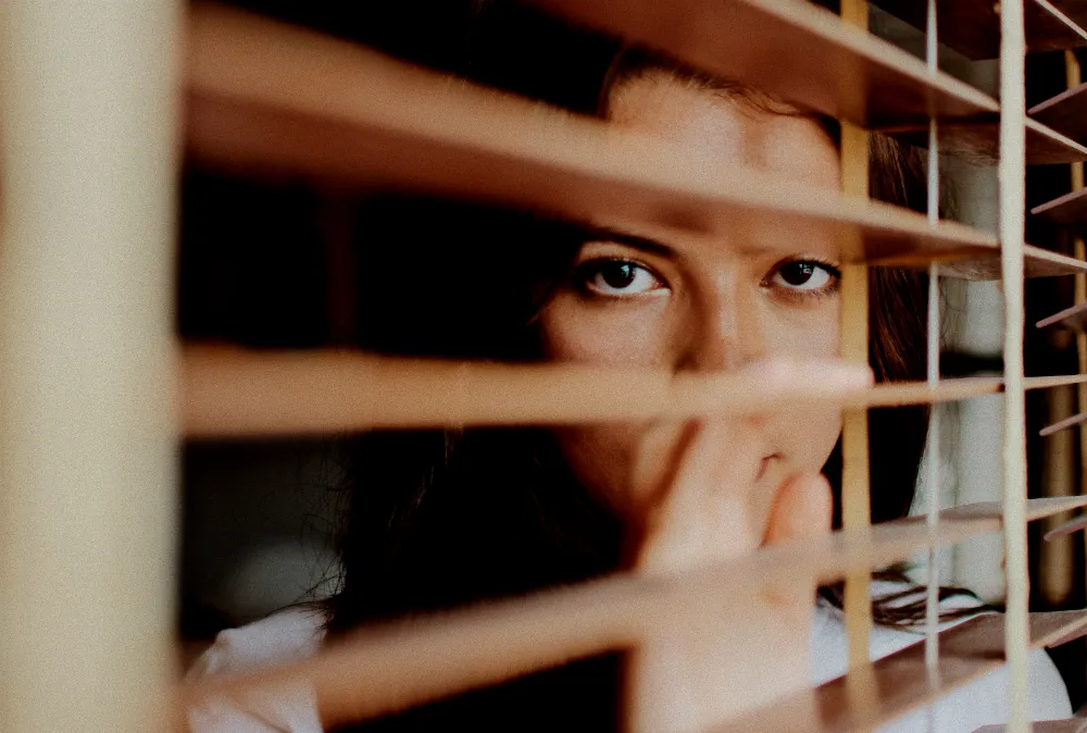 anxious_woman_at_window.jpg