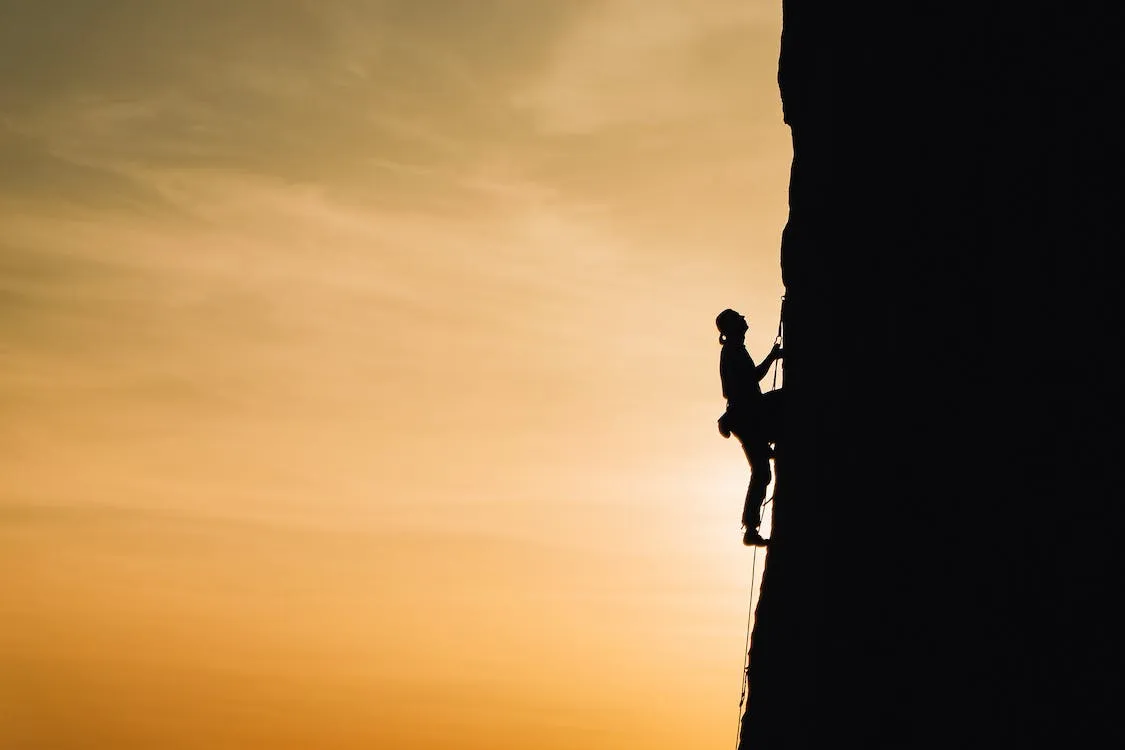 "Person Rock Climbing"