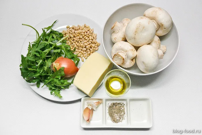 Mushrooms stuffed with arugula and nuts