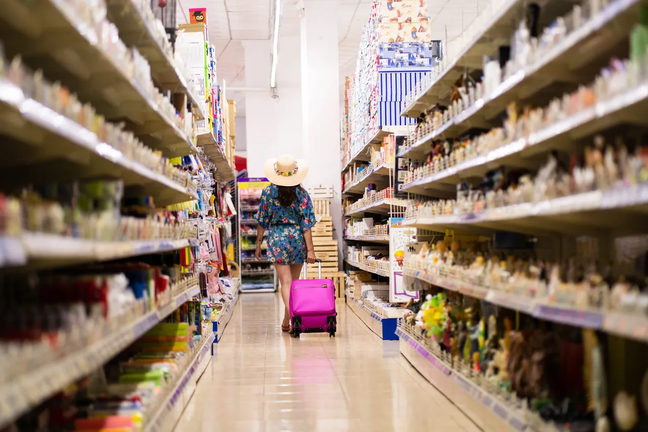 shelves-full-of-products-in-a-shop-with-a-woman-wa-2023-11-27-05-07-03-utc (1).jpg