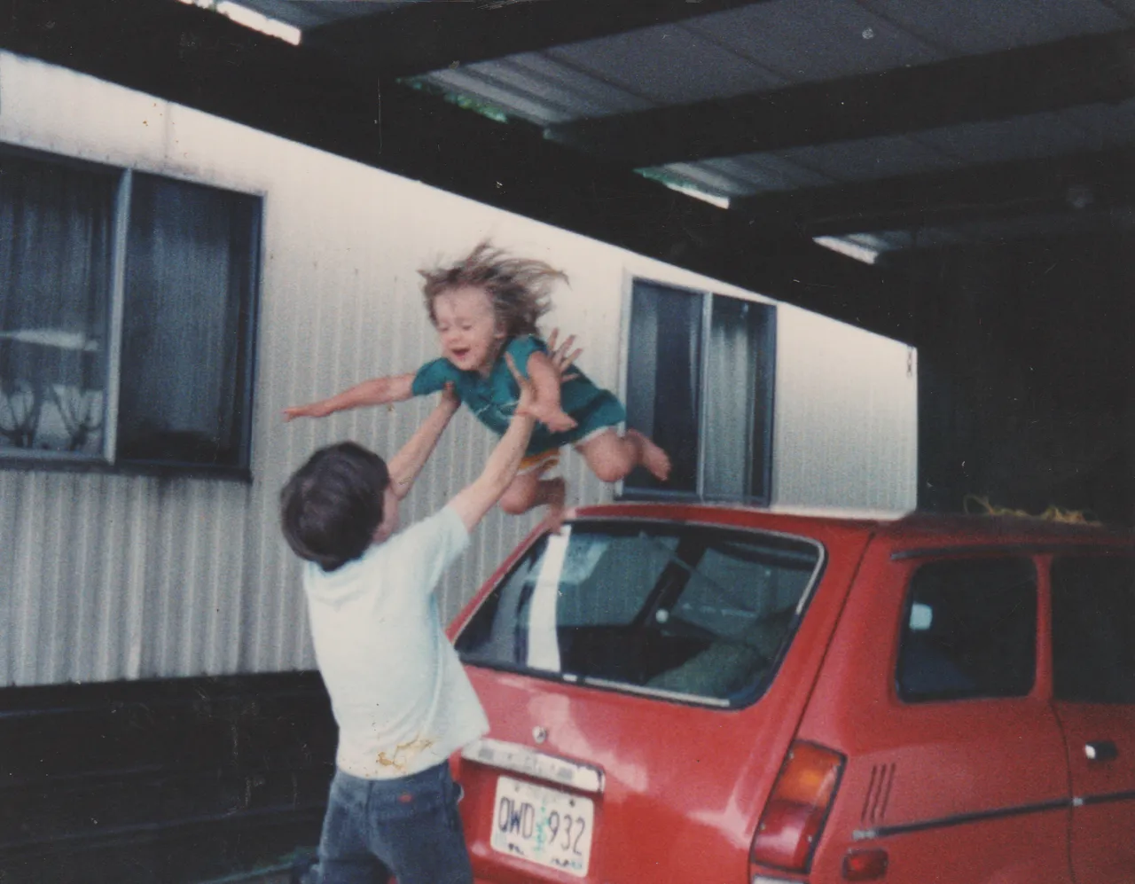 1992 - Rick catching Crystal off the orange car - apx date.png