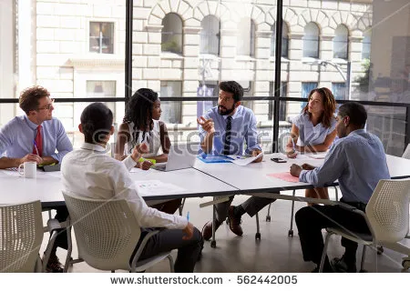 stock-photo-corporate-business-team-and-manager-in-a-meeting-close-up-562442005.jpg