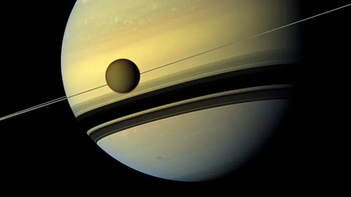 Titan in front of Saturn