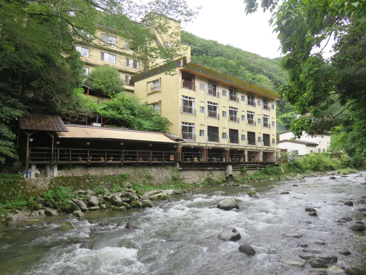 One of the hotels on the river, with a restaurant right next to the river and private hot springs in the better rooms.