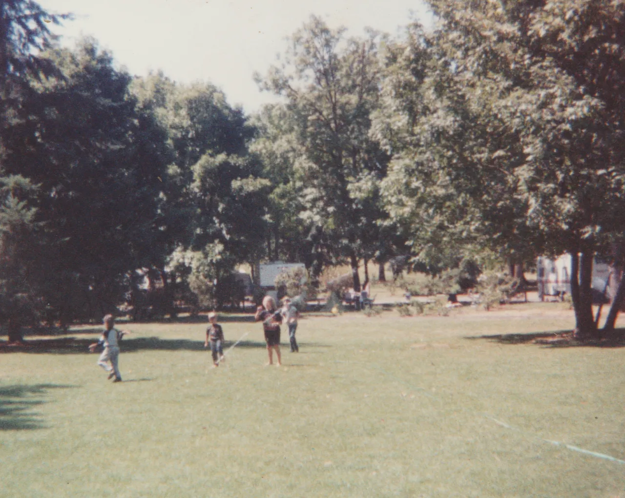 1991-08 - Camping - Joey, Rick, Crystal, Katie, mom, dad, others, tent, picnic table, field, food, playing, includes maybe Sunday or weekend-1.png