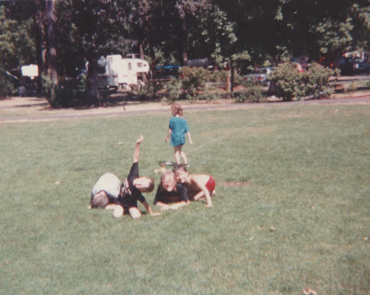 1991-08 - Camping - Joey, Rick, Crystal, Katie, mom, dad, others, tent, picnic table, field, food, playing, includes maybe Sunday or weekend-2.png