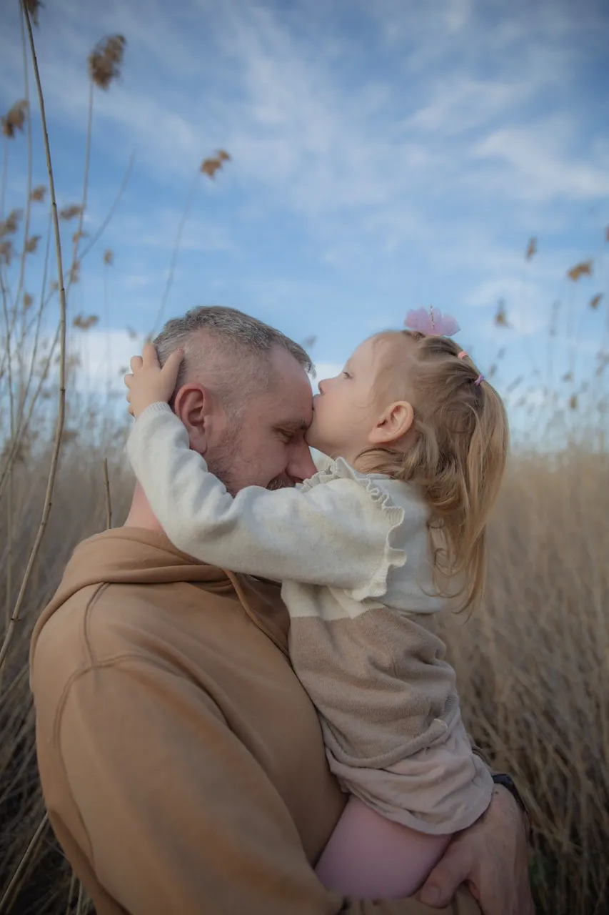 free-photo-of-father-holding-and-hugging-daughter.jpeg
