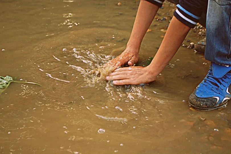 Dirty puddle still works as washing water, Baia Mare, Romania, 2011