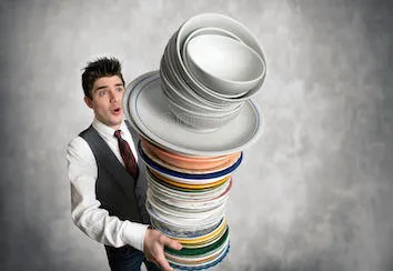 young-waiter-stack-plates-hand-to-fall-93604482.jpg