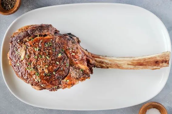 tomahawk-rib-eye-steak-2313425-hero-01-98fc6c07472c440fbdfdd87db6c71e26.jpg