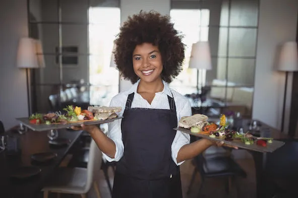 portrait-smiling-waitress-holding-food-tray-restaurant-92578650.jpg