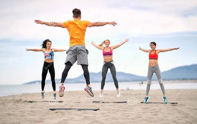 fitness-people-jumping-fitness-workout-beach-group-fitness-people-jumping-fitness-workout-beach-192257084.jpg