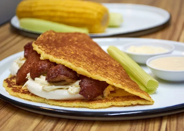 cachapa-stuffed-with-cheese-pork-rinds-typical-venezuelan-food-made-with-corn_203019-28.jpg