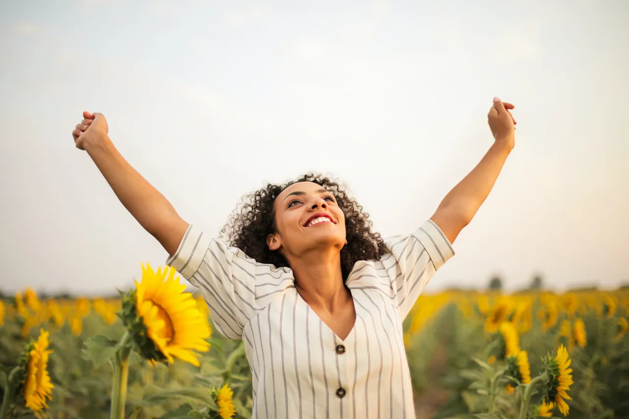 photo-of-woman-standing-on-sunflower-field-3756168.jpg