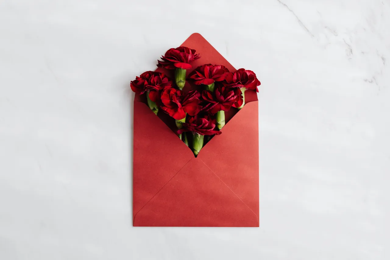 red-envelope-with-fresh-red-flowers-inside-4219890.jpg